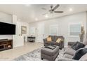 Bright living room with comfy seating and large TV at 2821 S Skyline Dr # 165, Mesa, AZ 85212