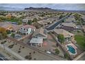 Aerial view showing the house, pool, and surrounding neighborhood at 4648 S Emery --, Mesa, AZ 85212