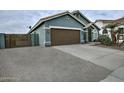 House exterior with brown garage door and gravel driveway at 4648 S Emery --, Mesa, AZ 85212