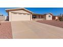 House exterior featuring a two-car garage at 6440 E Dallas St, Mesa, AZ 85205