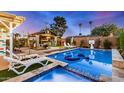 Inviting backyard oasis featuring a sparkling pool and relaxing patio at 8213 E Mitchell Dr, Scottsdale, AZ 85251