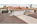 Rear view of the house showcasing a casita and solar panels at 8709 W Monroe St, Peoria, AZ 85345