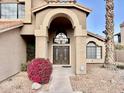 Elegant double front doors and lush landscaping at 938 W Iris Dr, Gilbert, AZ 85233