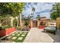 Private backyard patio with seating area and attractive landscaping at 10473 N 87Th Pl, Scottsdale, AZ 85258