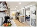 Modern kitchen with gray cabinets and marble countertops at 10529 W Palmeras Dr, Sun City, AZ 85373