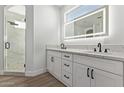 Elegant bathroom with double vanity, quartz countertop, and a large walk-in shower at 10662 S 297Th Ave, Palo Verde, AZ 85343