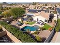 Luxury backyard oasis with pool, spa, and solar panels at 10724 S Mustang Dr, Goodyear, AZ 85338