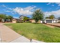 Beautiful two-story home with a spacious lawn and mature trees at 11051 N 53Rd Ave, Glendale, AZ 85304