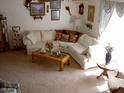 Cozy living room featuring a large sectional sofa and coffee table at 11051 N 53Rd Ave, Glendale, AZ 85304