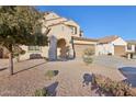 Two-story house with a large driveway and landscaping at 1132 W Santa Gertrudis Trl, San Tan Valley, AZ 85143