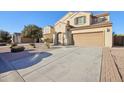 Two-story house with a large driveway and landscaping at 1132 W Santa Gertrudis Trl, San Tan Valley, AZ 85143