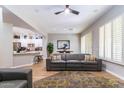 Open living area with gray sectional sofa and kitchen views at 11683 N 135Th Pl, Scottsdale, AZ 85259