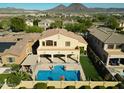 Stunning aerial view showcasing the home's architecture and landscape at 13347 W Via Caballo Blanco --, Peoria, AZ 85383