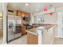 Updated kitchen with stainless steel appliances and tile counters at 1374 W 16Th St, Tempe, AZ 85281