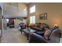 Spacious living room with high ceilings and elegant furniture at 1406 S Navajo Ln, Coolidge, AZ 85128