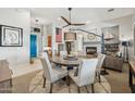 Bright dining area with a round table and view into living room at 14501 N Lark Ct, Fountain Hills, AZ 85268