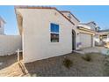 Tan colored house with a two-car garage and small yard at 18067 W Camino De Oro --, Surprise, AZ 85387