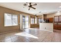 Kitchen and dining area with tile floors and sliding door to patio at 18473 W Piedmont Rd, Goodyear, AZ 85338