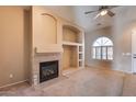 Living room features a fireplace and built-in shelving at 18473 W Piedmont Rd, Goodyear, AZ 85338