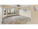 Spacious dining area with tile flooring and large window at 19806 N Stardust Blvd, Sun City West, AZ 85375