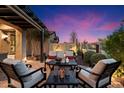 Landscaped backyard with seating area at sunset at 2129 N Atwood --, Mesa, AZ 85207