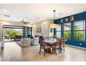 Bright dining area with table and chairs, open to living room at 2129 N Atwood --, Mesa, AZ 85207