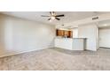 Bright living room featuring herringbone-patterned wood-look tile floors at 21655 N 36Th Ave # 106, Glendale, AZ 85308