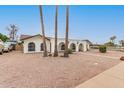 Front view of a single-story home with desert landscaping at 2407 E Encanto St, Mesa, AZ 85213