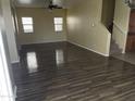 Bright living room with hardwood-style flooring and lots of natural light at 2431 N 83Rd Dr, Phoenix, AZ 85037