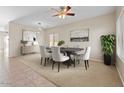 Elegant dining room features a modern table set, neutral colors, and stylish decor for comfortable entertaining at 29061 N Cactus Cir, San Tan Valley, AZ 85143