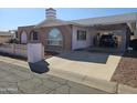 Brick home with carport and driveway at 297 Peretz Cir, Morristown, AZ 85342