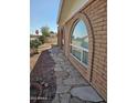 Brick home with a flagstone walkway at 297 Peretz Cir, Morristown, AZ 85342