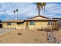 Brick single story home with a landscaped front yard and palm trees at 3808 W Mission Ln, Phoenix, AZ 85051