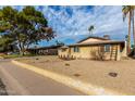 Ranch style home with a large front yard and mature trees at 3808 W Mission Ln, Phoenix, AZ 85051