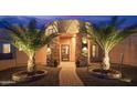 Elegant entryway with stone columns and palm trees at 39005 N 11Th Ave, Phoenix, AZ 85086