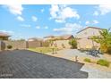 Backyard with patio and grassy area at 4026 E Madre Del Oro Dr, Cave Creek, AZ 85331