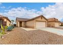 Charming single story home featuring a two car garage and desert landscaping at 521 W Jardin Loop, Casa Grande, AZ 85122