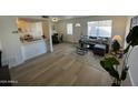 Bright living room with gray sectional sofa and modern coffee table at 5238 N 42Nd Ln, Phoenix, AZ 85019