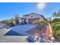 Front view of house with driveway and desert landscaping at 5491 W Pueblo Dr, Eloy, AZ 85131