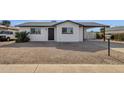 Newly remodeled single story home with a gravel front yard at 5921 W Hearn Rd, Glendale, AZ 85306