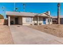 Single story home with driveway and mature trees at 604 W Emerald Ave, Mesa, AZ 85210