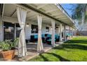 Covered patio with seating area and lush lawn at 829 E 9Th Pl, Mesa, AZ 85203