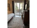 Bedroom with sliding glass door leading to private patio at 9450 E Becker Ln # 1068, Scottsdale, AZ 85260