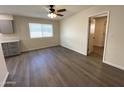 Bright dining area with hardwood floors and access to kitchen at 9814 N Balboa Dr, Sun City, AZ 85351