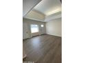 Spacious living room with vinyl plank flooring and high ceilings at 9814 N Balboa Dr, Sun City, AZ 85351