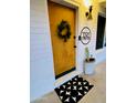 Inviting front door entrance with a modern wreath and stylish doormat at 1246 E Vista Ave, Phoenix, AZ 85020