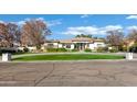 House with a large front yard and circular driveway at 2536 E Wood Pl, Chandler, AZ 85249