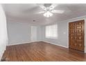 Bright living room featuring hardwood floors and a ceiling fan at 2650 W Union Hills Dr # 352, Phoenix, AZ 85027