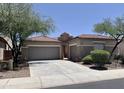 Two-car garage and welcoming entryway at 42127 N Celebration Way, Anthem, AZ 85086