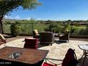 Spacious patio with seating area and mountain views at 42127 N Celebration Way, Anthem, AZ 85086